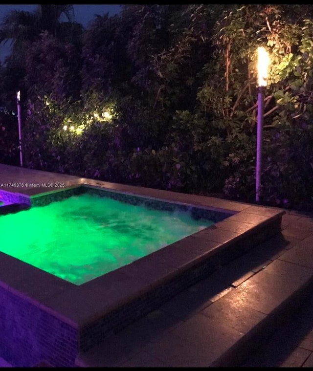 1155 S Biscayne Point Rd, Miami Beach, FL 33141 - view of pool at twilight