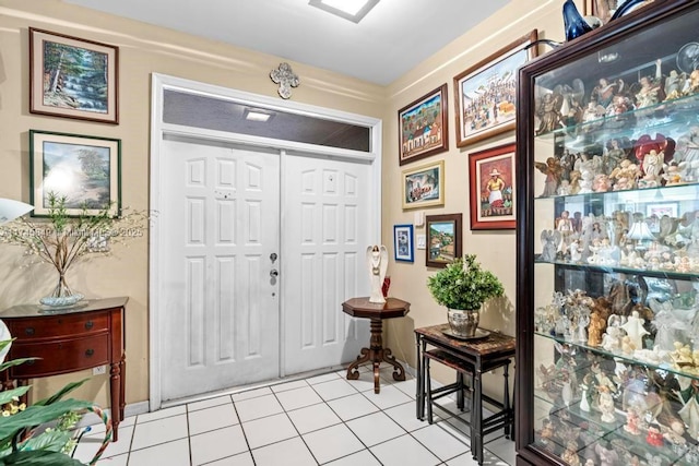 foyer featuring light tile patterned flooring