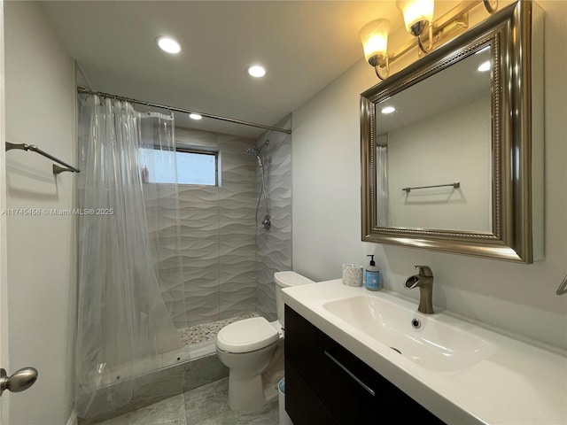 bathroom featuring vanity, toilet, and walk in shower