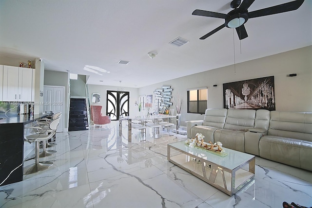 living room featuring ceiling fan