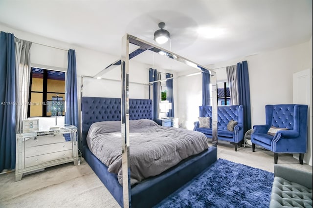 bedroom with ceiling fan and carpet flooring