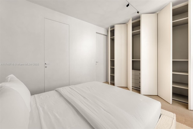 bedroom with multiple closets