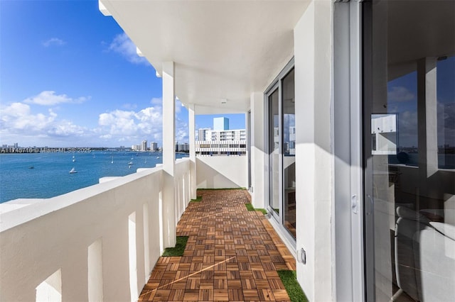 balcony featuring a water view