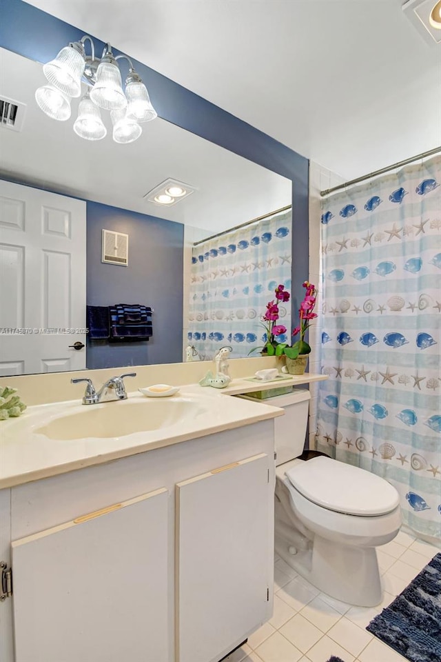 bathroom featuring tile patterned flooring, vanity, a shower with shower curtain, and toilet