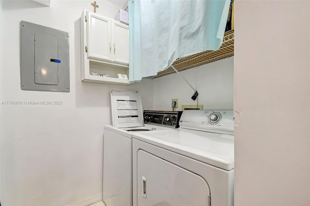 laundry room featuring washer and clothes dryer and electric panel