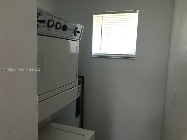 clothes washing area featuring laundry area and washer / dryer