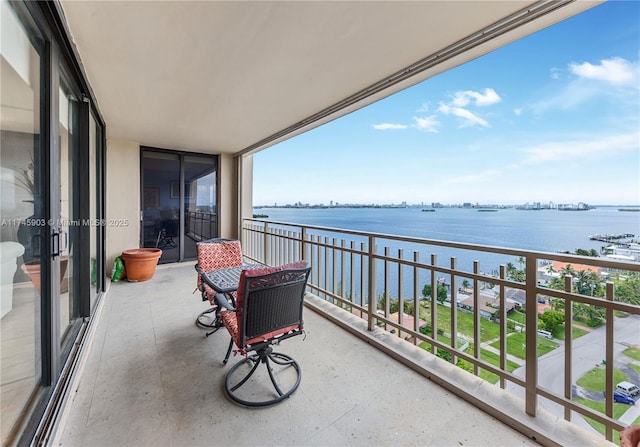 balcony featuring a water view