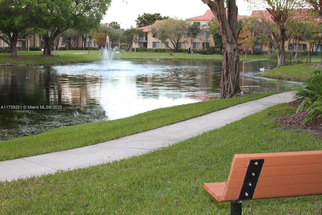 10717 Cleary Blvd Unit 203, Plantation, FL 33324 - surrounding community featuring a lawn and a water view