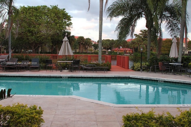 10717 Cleary Blvd Unit 203, Plantation, FL 33324 - community pool with fence and a patio area