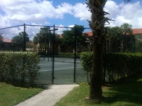 10717 Cleary Blvd Unit 203, Plantation, FL 33324 - view of tennis court with fence