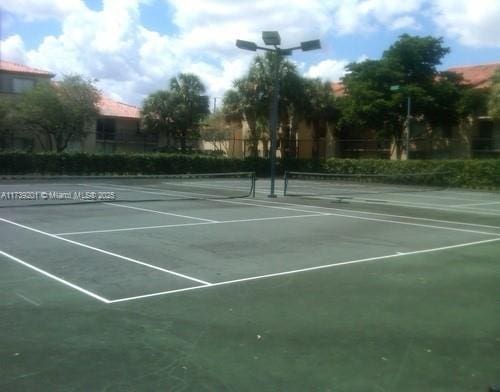 10717 Cleary Blvd Unit 203, Plantation, FL 33324 - view of sport court featuring fence