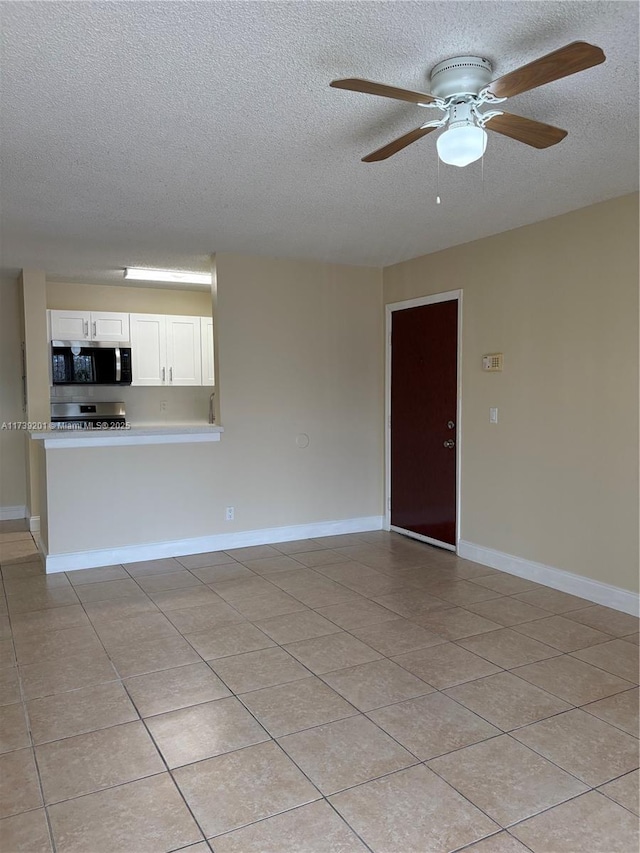 10717 Cleary Blvd Unit 203, Plantation, FL 33324 - unfurnished living room featuring a textured ceiling, a ceiling fan, baseboards, and light tile patterned floors