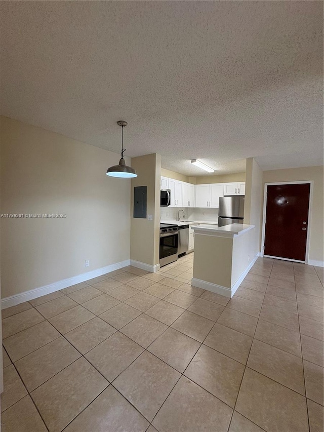 10717 Cleary Blvd Unit 203, Plantation, FL 33324 - kitchen featuring light tile patterned floors, electric panel, stainless steel appliances, and baseboards