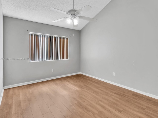 unfurnished room with ceiling fan, light hardwood / wood-style flooring, and a textured ceiling