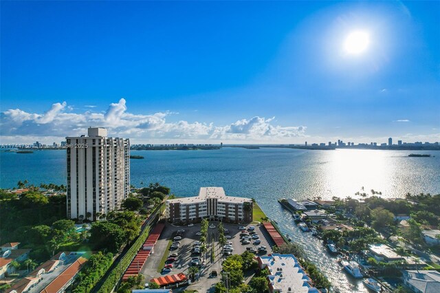 birds eye view of property featuring a water view and a view of city