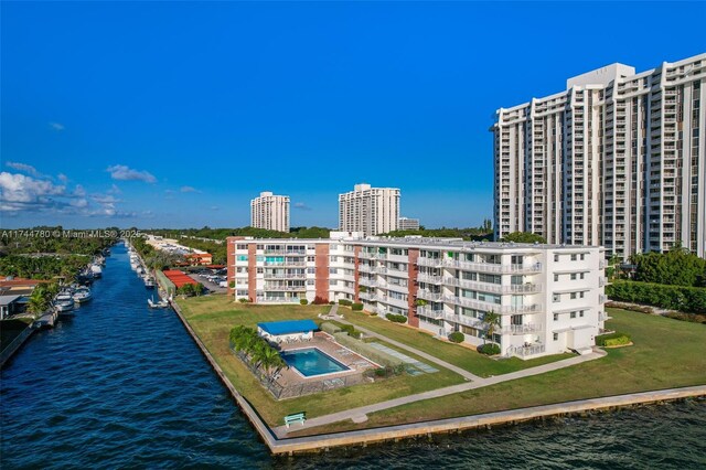 view of property featuring a water view and a view of city