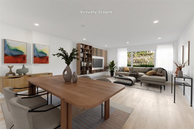 dining space featuring recessed lighting and light wood-type flooring