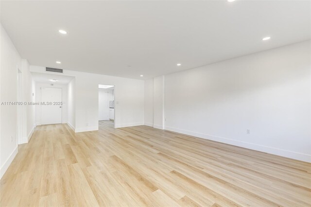 unfurnished room with recessed lighting, baseboards, light wood-style floors, and visible vents