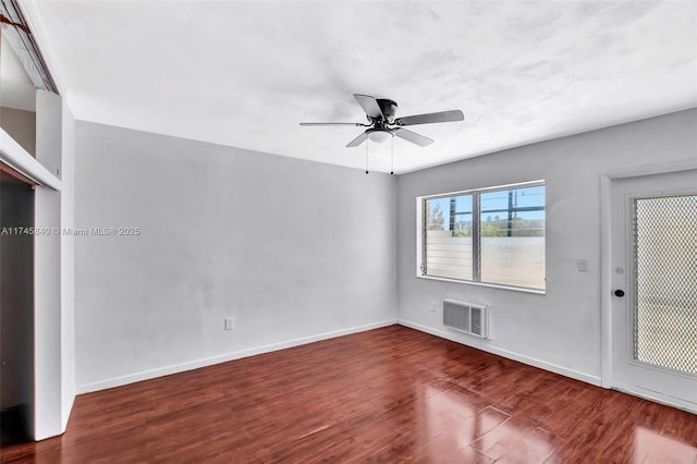 spare room with ceiling fan and dark hardwood / wood-style floors