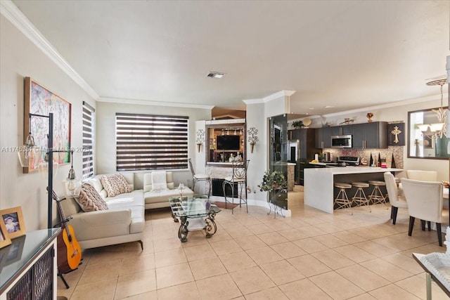 living room featuring light tile patterned floors, visible vents, a notable chandelier, and ornamental molding