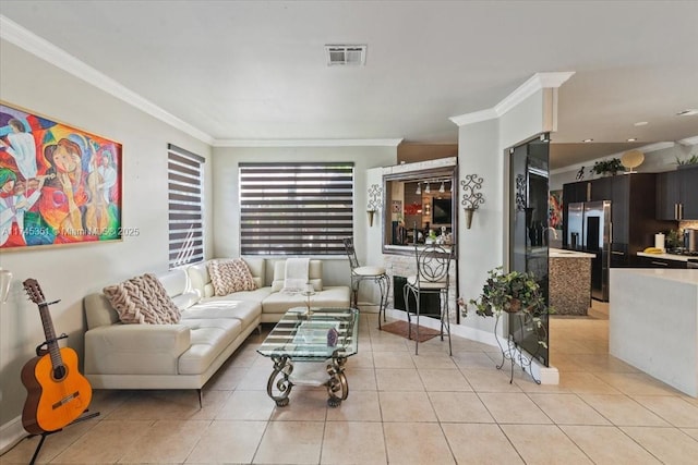 living area with ornamental molding, visible vents, and light tile patterned floors