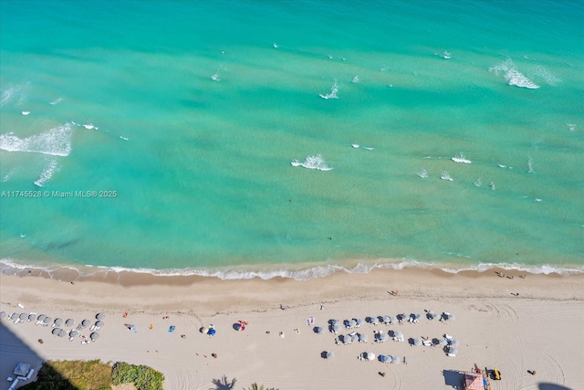 aerial view featuring a water view and a view of the beach