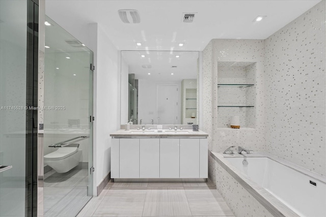 full bathroom featuring vanity, toilet, and separate shower and tub