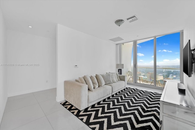 tiled living room with expansive windows