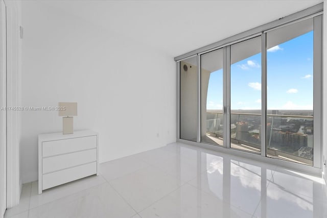 empty room featuring floor to ceiling windows