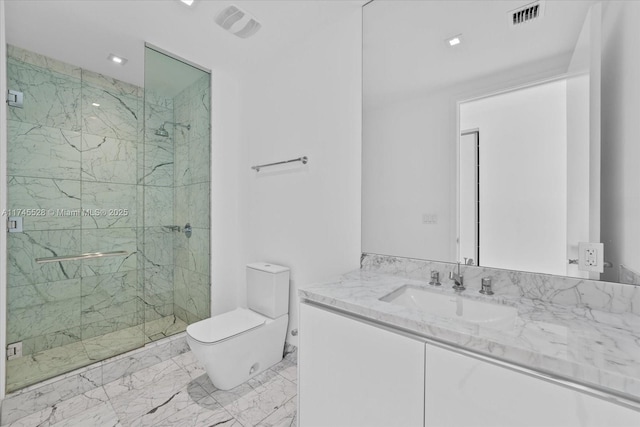 bathroom with vanity, an enclosed shower, and toilet