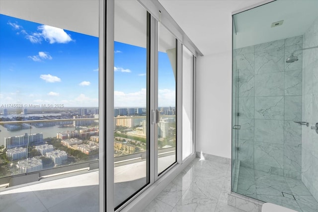 interior space with a water view and a shower with door