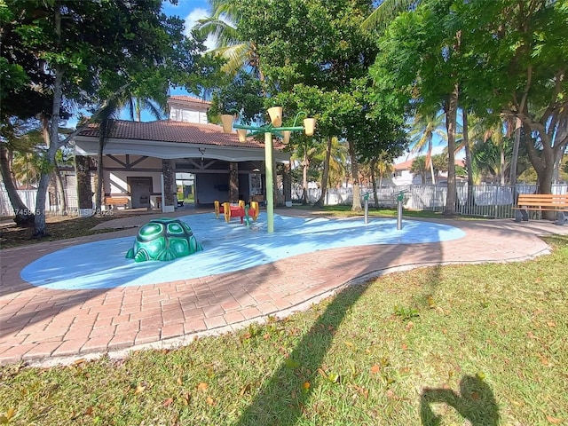 exterior space featuring a patio, fence, and a lawn