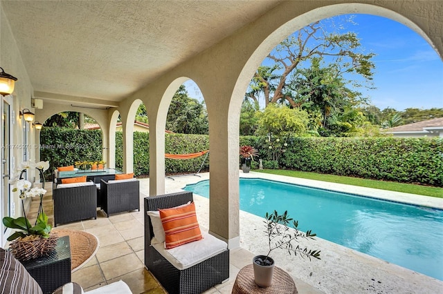 view of swimming pool featuring a fenced in pool, a patio area, and a fenced backyard