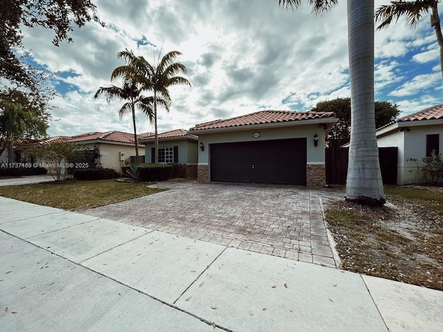 mediterranean / spanish house featuring a garage