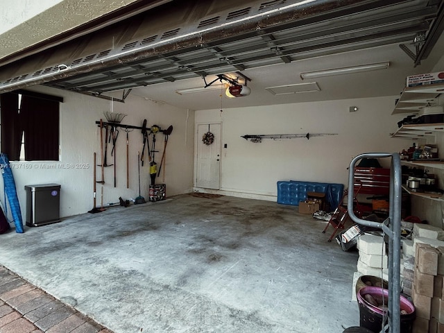 garage featuring a garage door opener