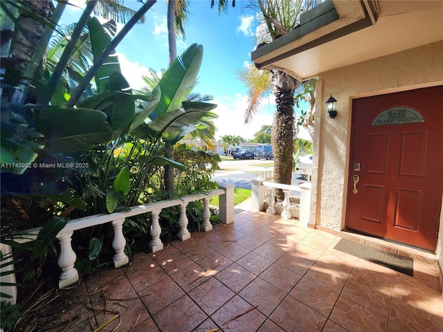 exterior space with covered porch and stucco siding