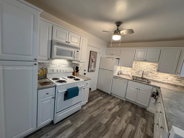 kitchen featuring white cabinetry, sink, white appliances, and dark wood-type flooring