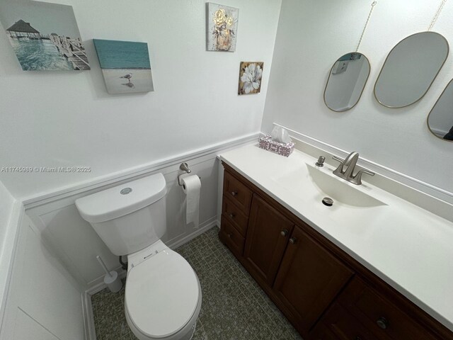 4770 NW 21st St Unit 208, Lauderhill, FL 33313 - bathroom with vanity and wainscoting
