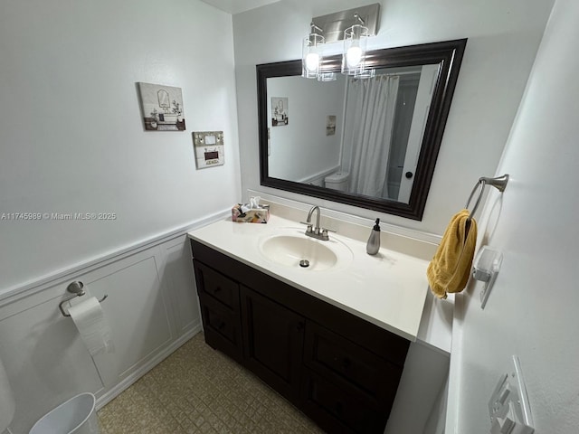 4770 NW 21st St Unit 208, Lauderhill, FL 33313 - full bathroom with vanity, a shower with shower curtain, and wainscoting