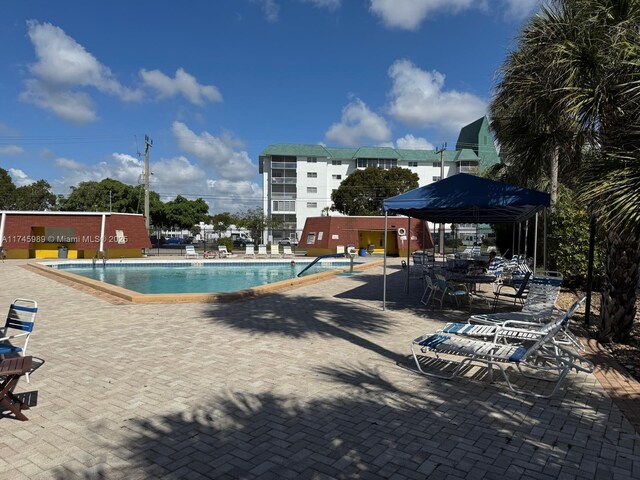 4770 NW 21st St Unit 208, Lauderhill, FL 33313 - community pool with a patio area and a gazebo