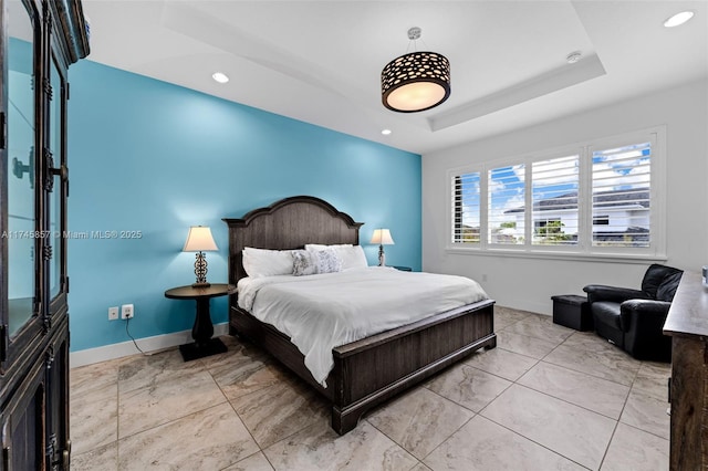 bedroom with a tray ceiling