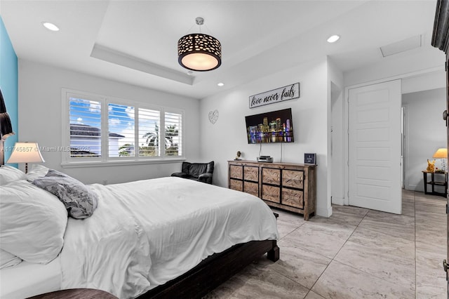 bedroom with a tray ceiling