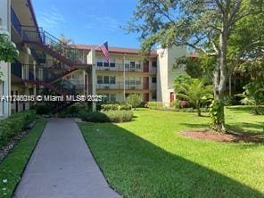 view of home's community featuring a yard