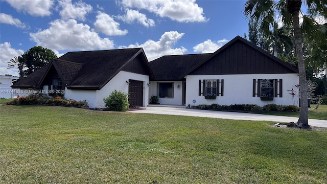 view of front of house with a garage and a front yard