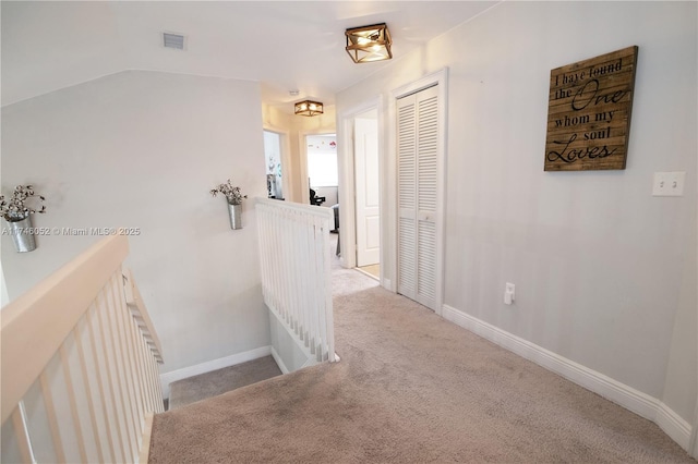 corridor with carpet floors