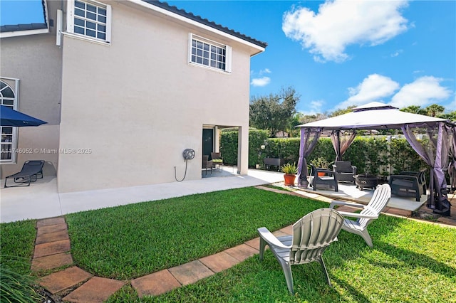 view of yard with a gazebo and a patio area