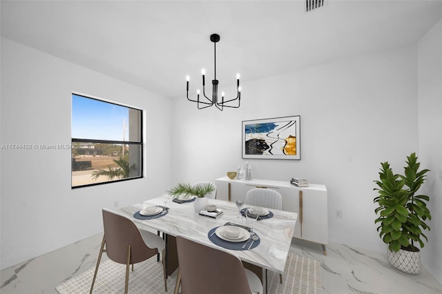 dining room featuring a notable chandelier