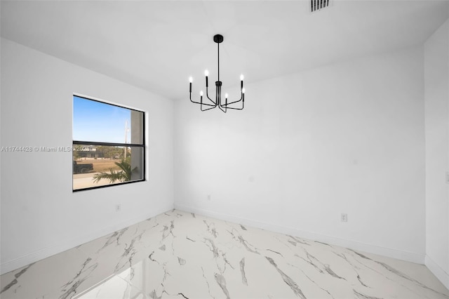 unfurnished room featuring an inviting chandelier