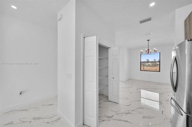 bathroom featuring a chandelier