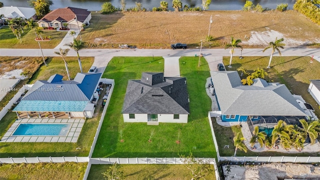 birds eye view of property with a water view